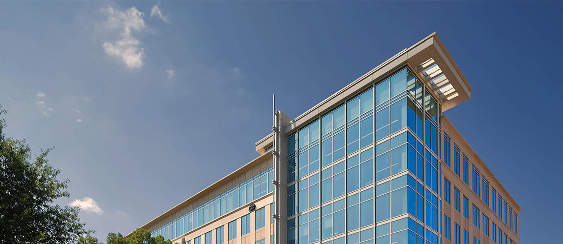 A view of the top of a tall glass building